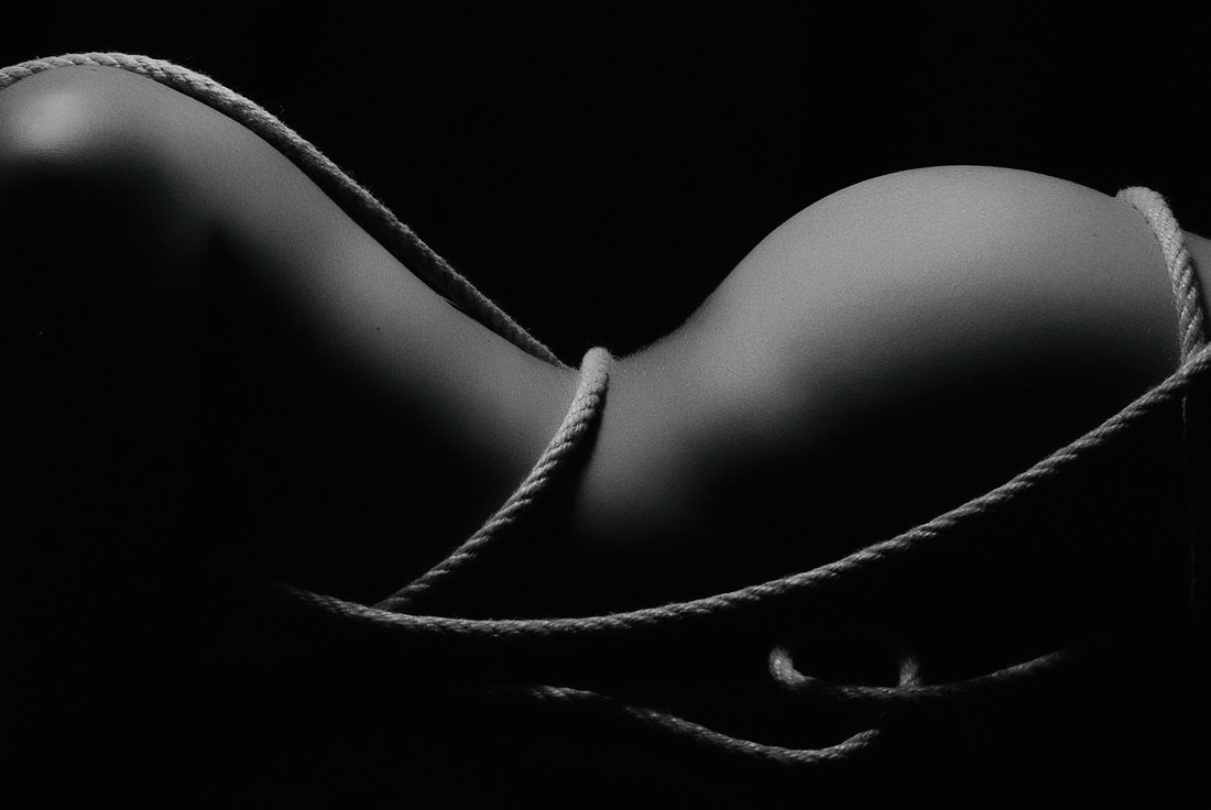 grayscale-photography-of-naked-woman-covered-with-rope-2H4PbFllKkE