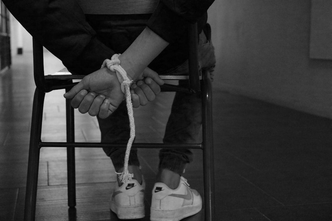person-tied-up-on-a-chair-oo3teQgOmWI
