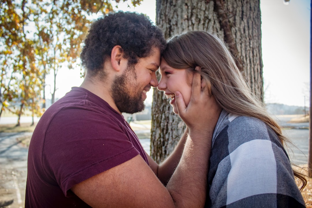 man-and-woman-standing-face-to-face-near-tree-QwCezIlCI3c