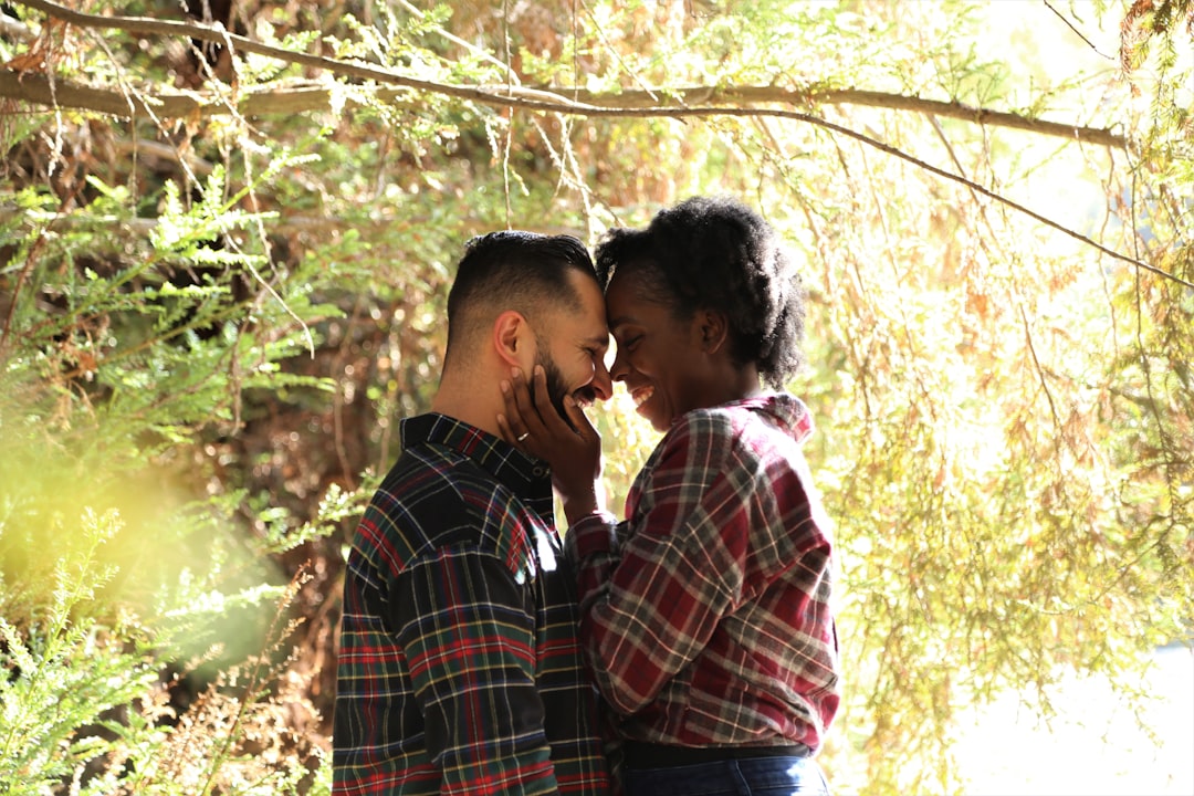 man-in-blue-white-and-red-plaid-dress-shirt-kissing-woman-in-white-shirt-r_b_IeA-O2U
