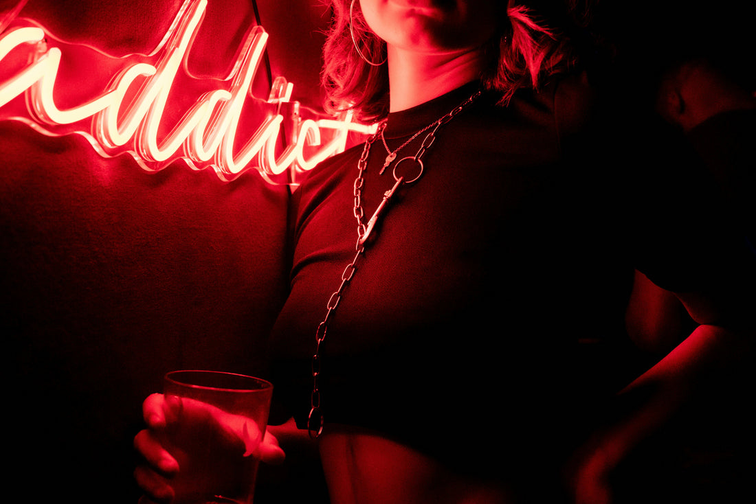 woman-in-black-shirt-holding-clear-drinking-glass-UUwXBad0RMo