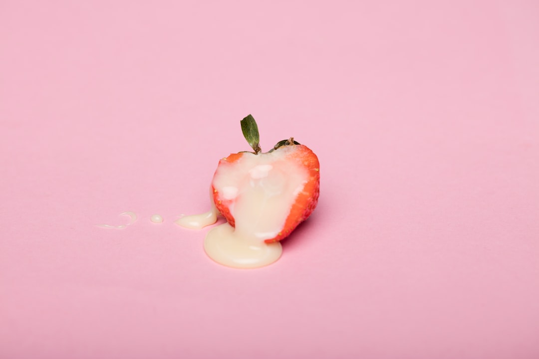red-cherry-fruit-on-pink-surface-nJYtCJRu4OM