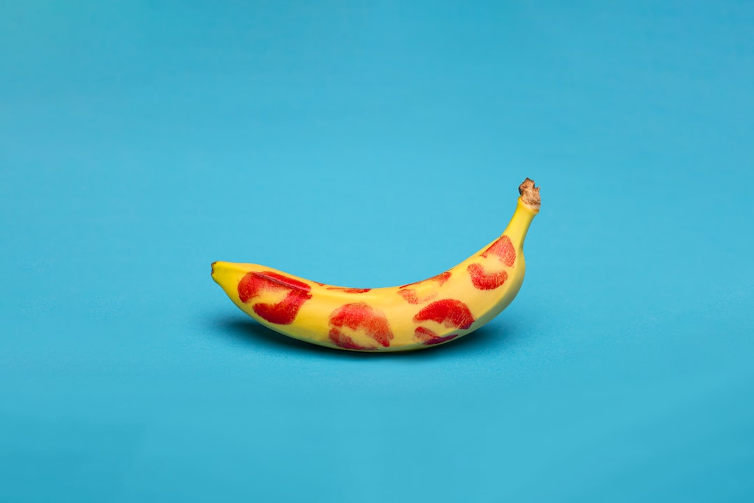 yellow-banana-fruit-on-blue-surface-0CeXmgdl55U