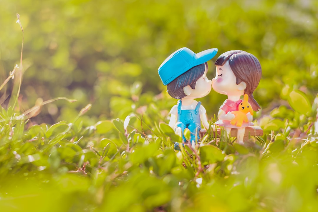 girl-in-blue-hat-on-yellow-flower-field-during-daytime-IF9k1SPENe0