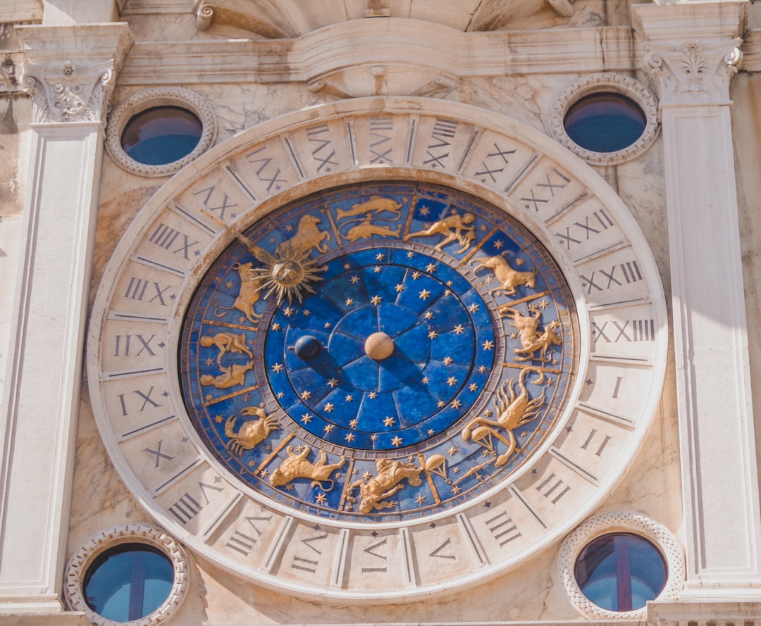 round-gold-and-blue-analog-clock-qI8SdtcWpiw