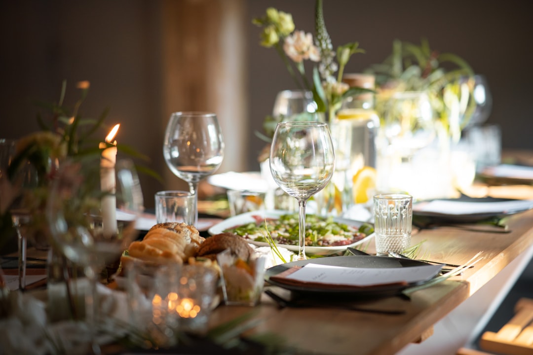 a-table-set-for-a-formal-dinner-with-wine-glasses-and-plates-cGZ-X0nAUgY