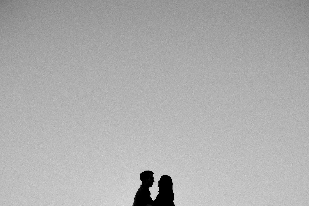 a man and a woman standing next to each other
