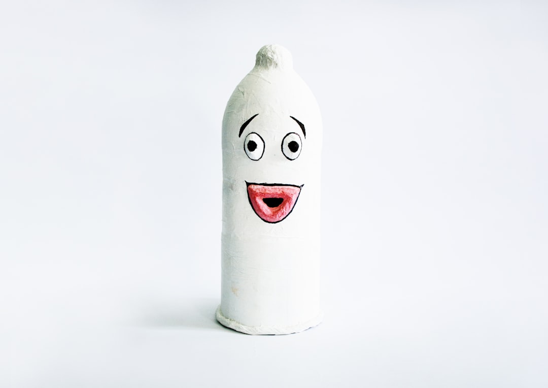 a-white-bottle-with-a-face-drawn-on-it-ZWbqrBF28t8