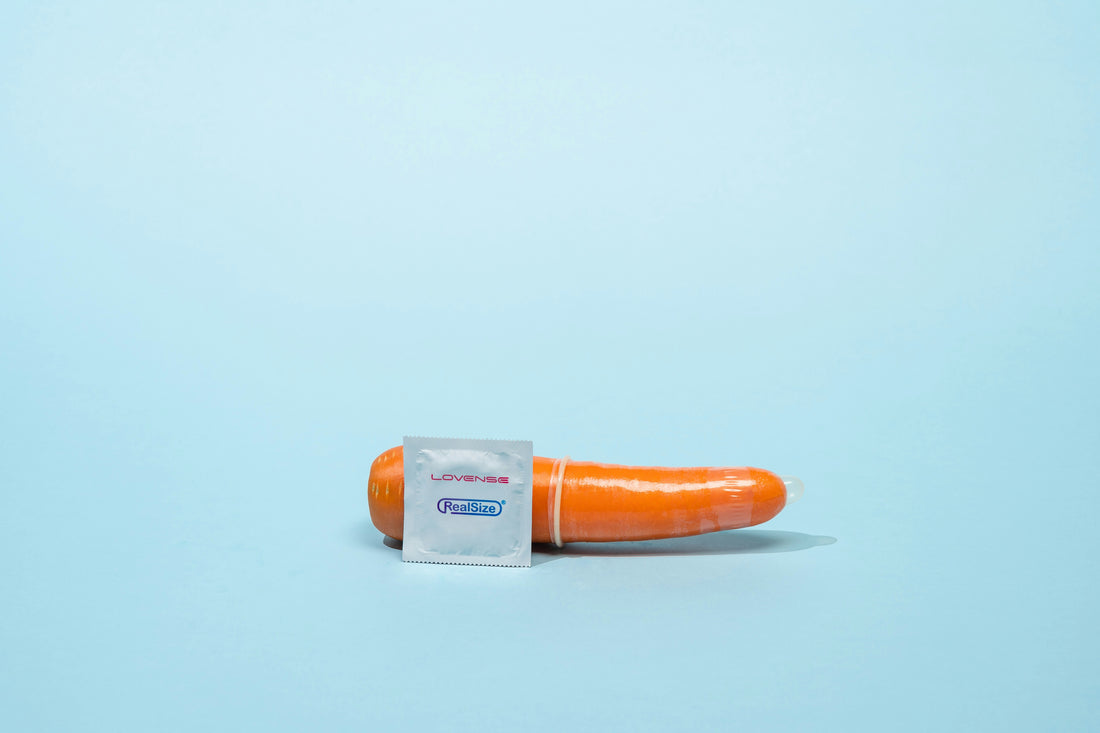 a single carrot wrapped in a plastic bag
