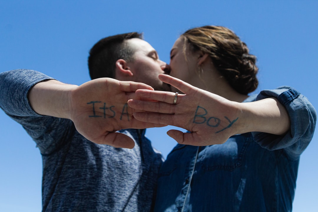 a-man-and-a-woman-holding-their-hands-together-WBak-Qf95sw
