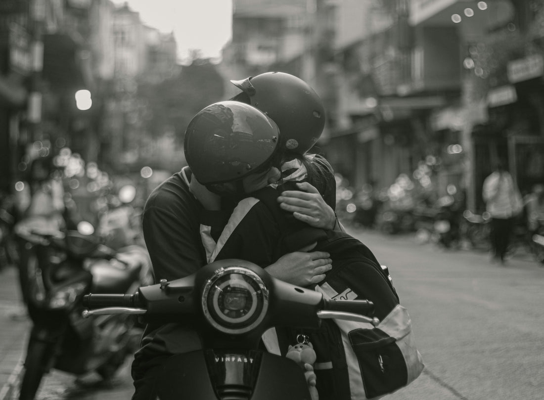 a couple of people that are sitting on a motorcycle