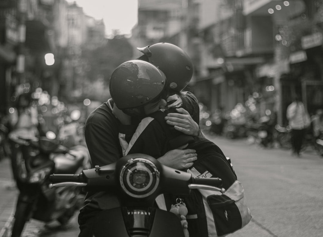 a couple of people that are sitting on a motorcycle