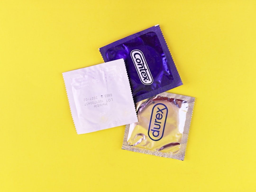 a-couple-of-bags-of-candy-sitting-on-top-of-a-yellow-table-Nyo7JTZmulA