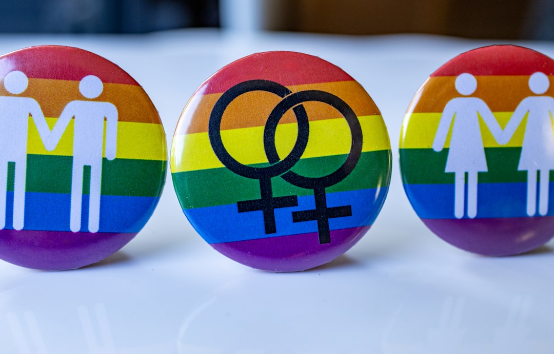 a-group-of-three-buttons-with-a-male-and-female-symbol-on-them-CjDRRmunMsc