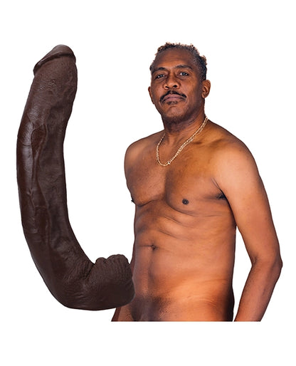 Adult star Dredd holding his massive 13.5 inch molded clone dildo showing realistic 1:1 scale