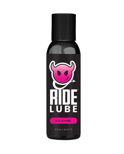 Bottle of Ride Lube with a black label and pink logo on a white background