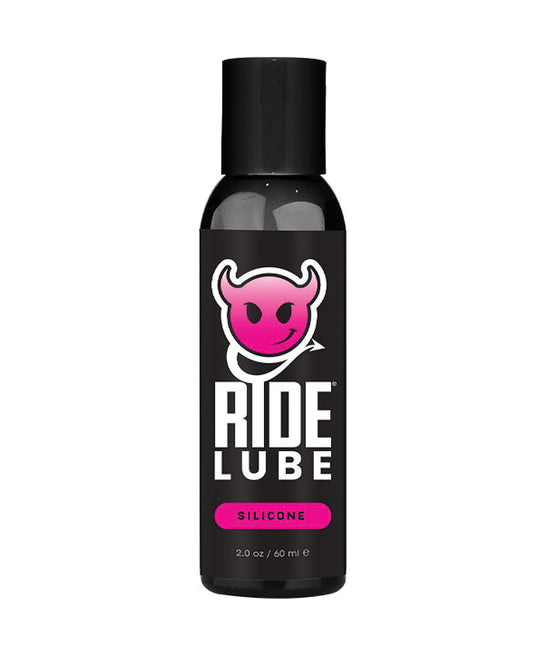 Bottle of Ride Lube with a black label and pink logo on a white background